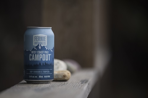 A single can of campout on a wooden plank