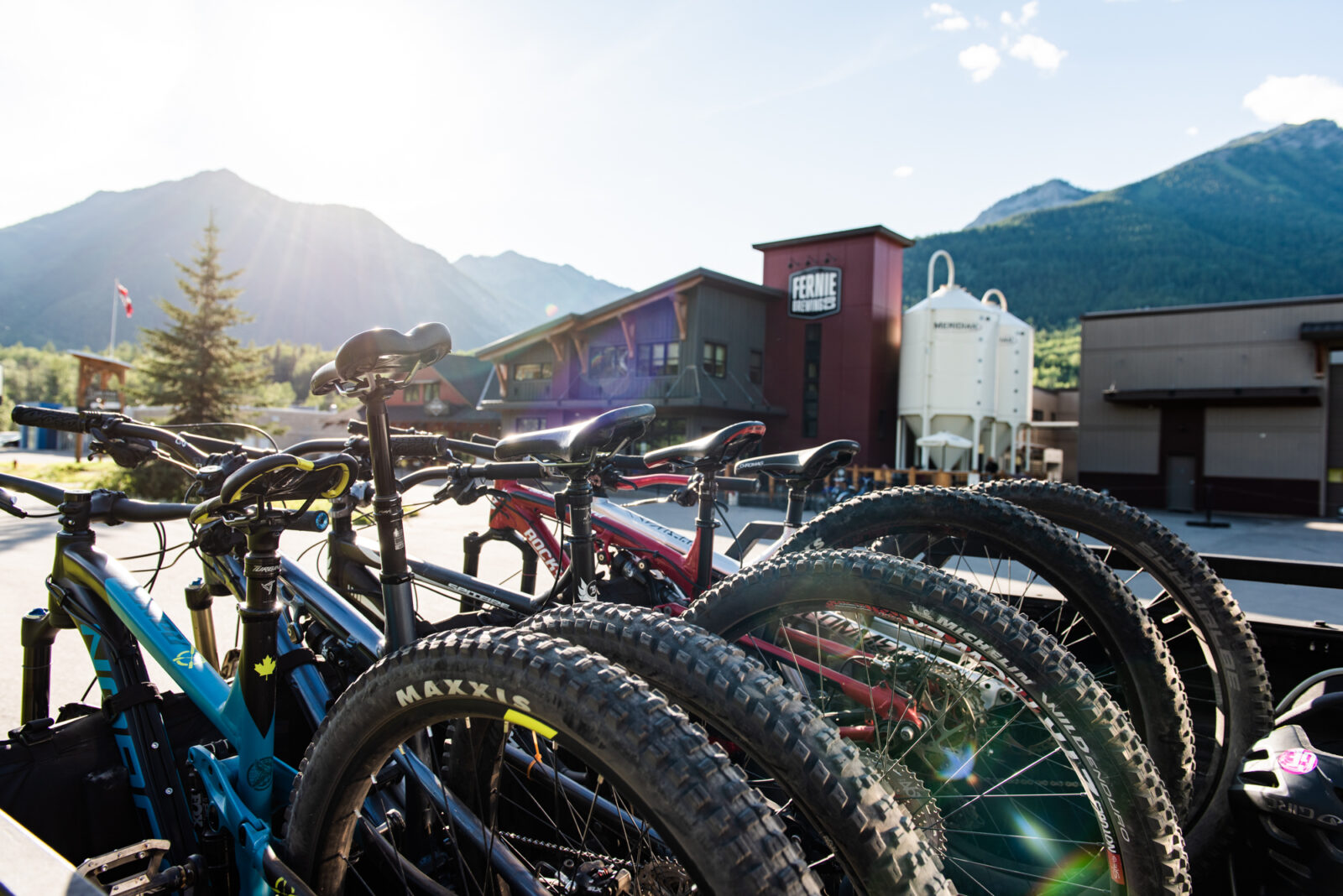 Mountain bikes on a tailgate in front of Fernie Brewing Co.