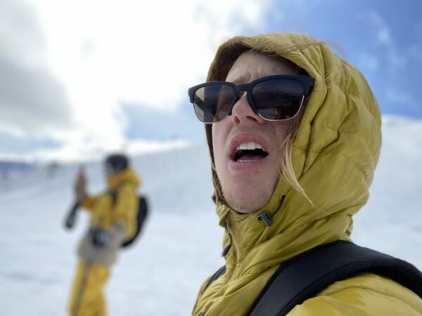 Freeskier Dyaln Siggers in yellow jacket and sunglasses.