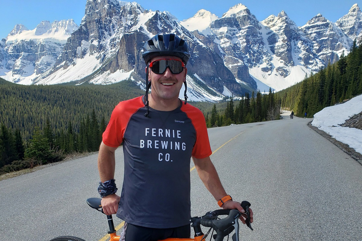 Ian ridinghis bike through the mountains.