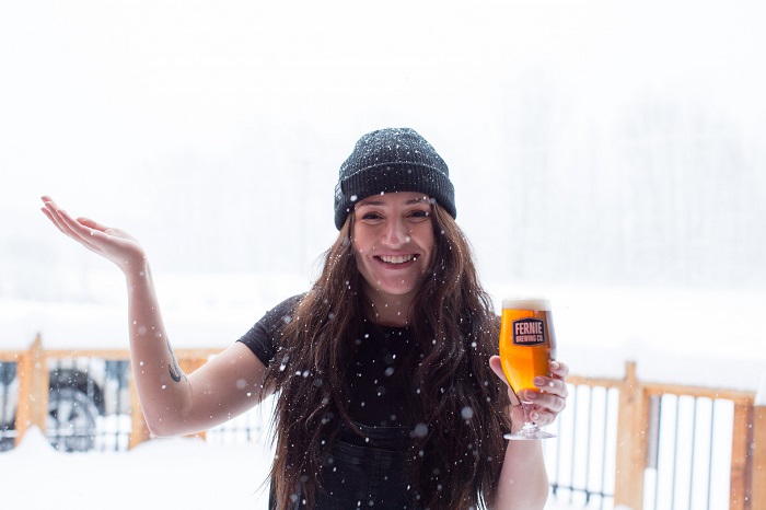 Girl in snow with drink