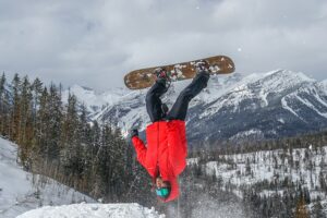 Dale flipping on a snowboard