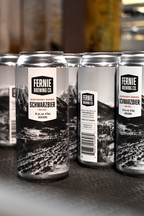 Cans of Schwarzbier getting canned