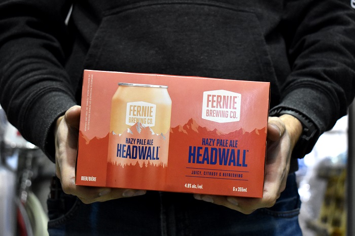 Someone holding a pack of headwall