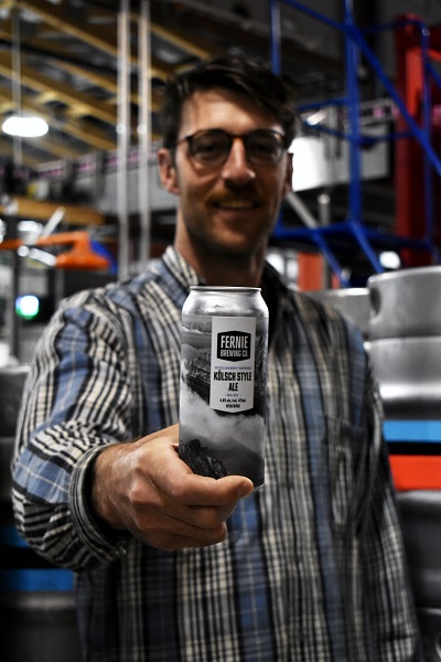 jack holding up a can of kolsch style beer