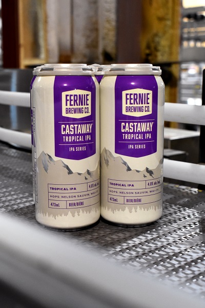 Four pack of Castaway on a canning line