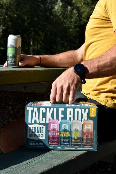 man holding a tacklebox pack