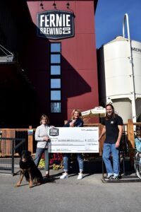 TMARS accepts a cheque with furry friends around