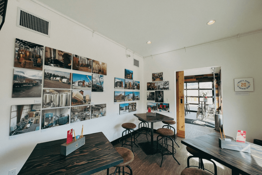 A gallery room with photos from Fernie Brewing's history on the walls.